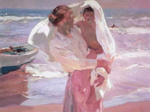 Mujer enla playa con un ni&ntilde;o